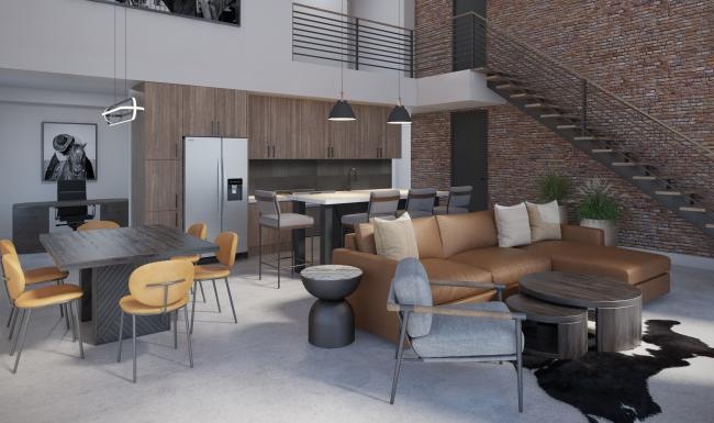 a room with a couch and chairs