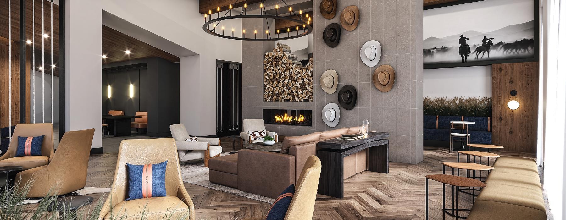 a living room with a chandelier and lounge seating